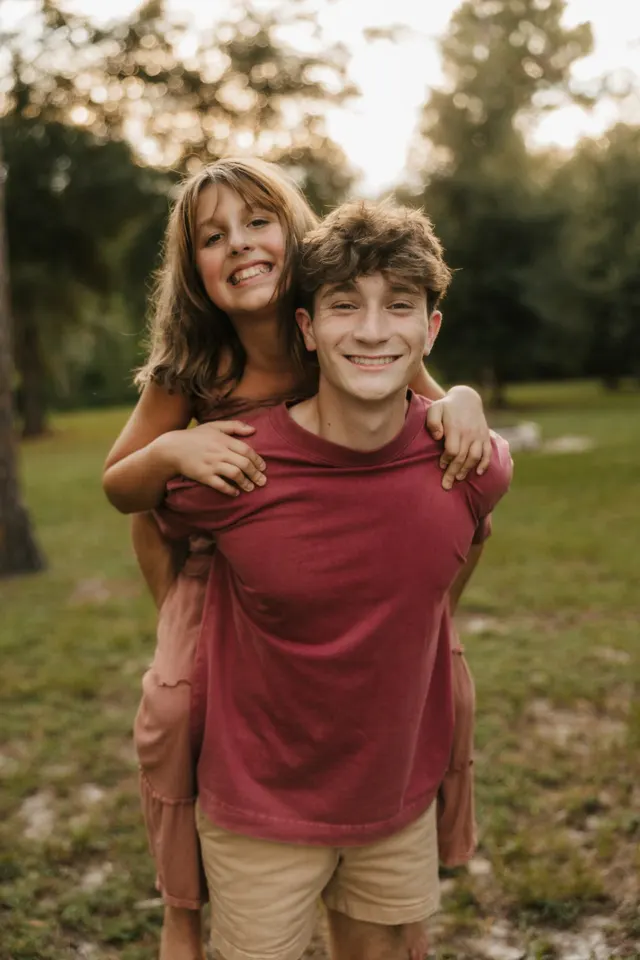 Kristian Sarakinis, owner of Crystal Clear Cleaning, outdoors with his family in Central Florida